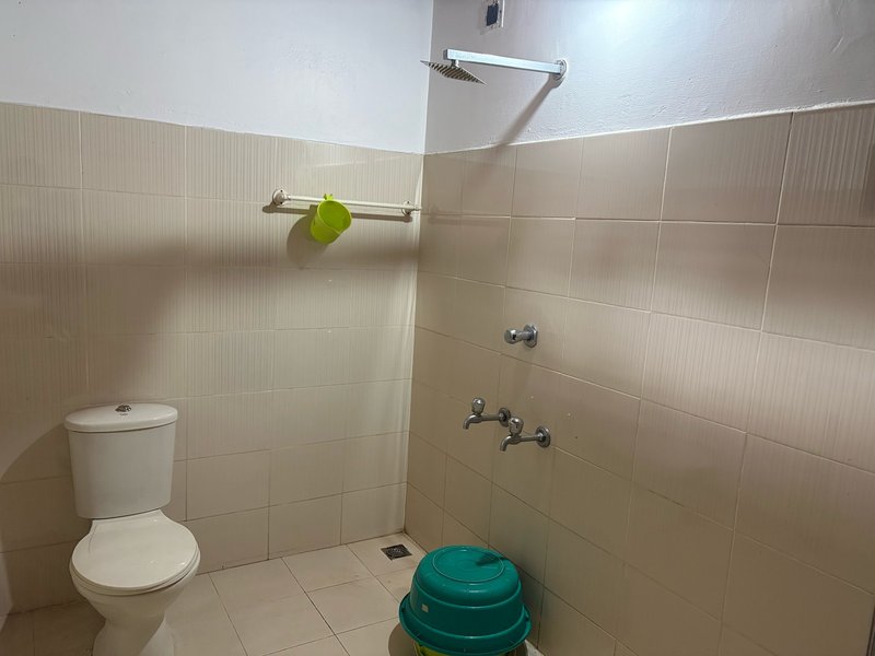 Shower and bath area at Gowrisankara guest bungalow